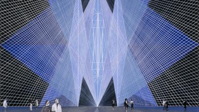 Photograph of a large-scale light installation featuring intersecting blue and white grid patterns forming a symmetrical, geometric tunnel. People stand and walk around the installation, highlighting its massive scale and immersive visual effect.