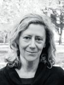 bw photo of a woman with curly blond bob