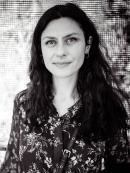 a bw portrait of a Slavic women with wavy dark hair