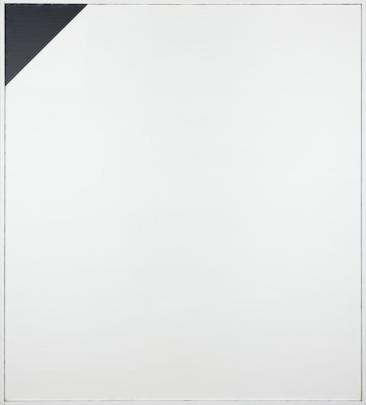Photograph of a minimalist artwork featuring a large white square canvas with a small black right triangle in the top left corner. The composition emphasizes contrast between the black and white areas, highlighting simplicity and geometric form.