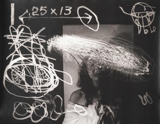 Photograph of a person with long hair and bare shoulders partially obscured by chaotic white chalk-like scribbles, arrows, and mathematical notations on a blackboard-like surface. The overlay includes a large arrow pointing right with "25 x 13," various circular and abstract shapes, and scattered lines